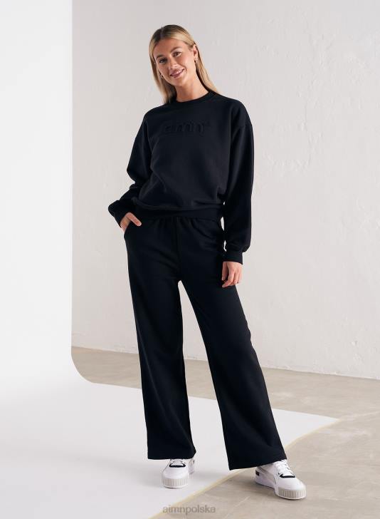 odzież JF4L671 kobiety AIM'N Czarne, proste spodnie dresowe z logo